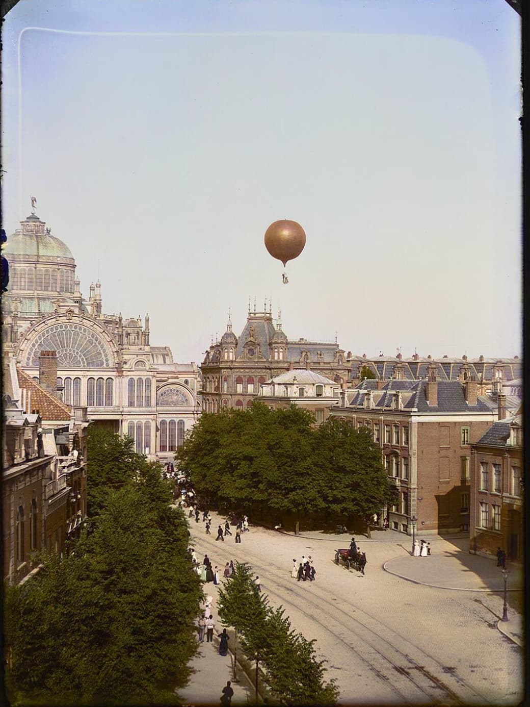 “Photograph of Amsterdam, the Netherlands, taken by Jacob Olie around 5 pm on the 8 July 1893, just after the ascent of the aeronaut Léon Mary with his hot air balloon ‘Koningin Wilhelmina’ from the garden of the Paleis voor Volksvlijt.”